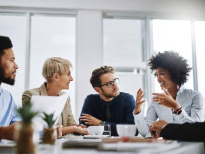 Shot of a group of businesspeople sitting together in a meeting